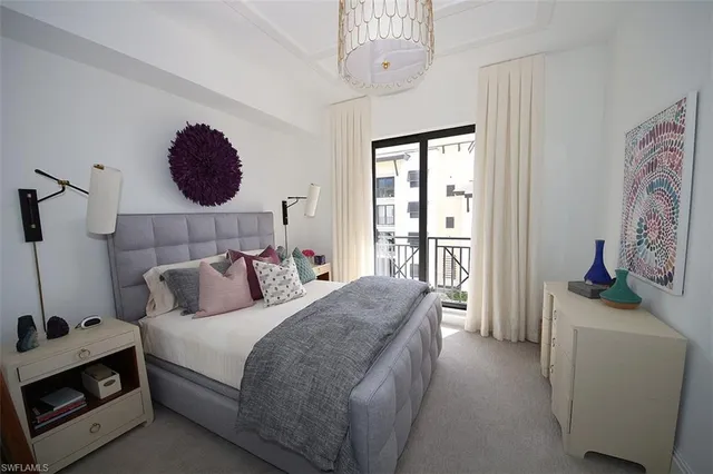 a bedroom with a bed and a fireplace