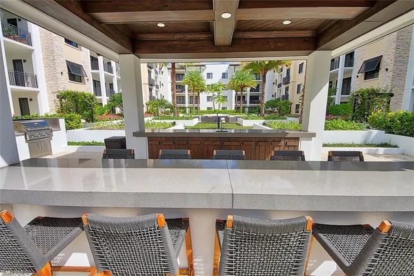a kitchen with granite countertop a stove and a sink