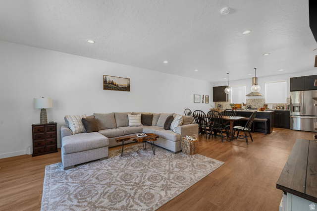 493 East Alice Way Layton, UT 84041 - Photo 10 of 31 Living area with light wood-style floors, recessed lighting, and a textured ceiling