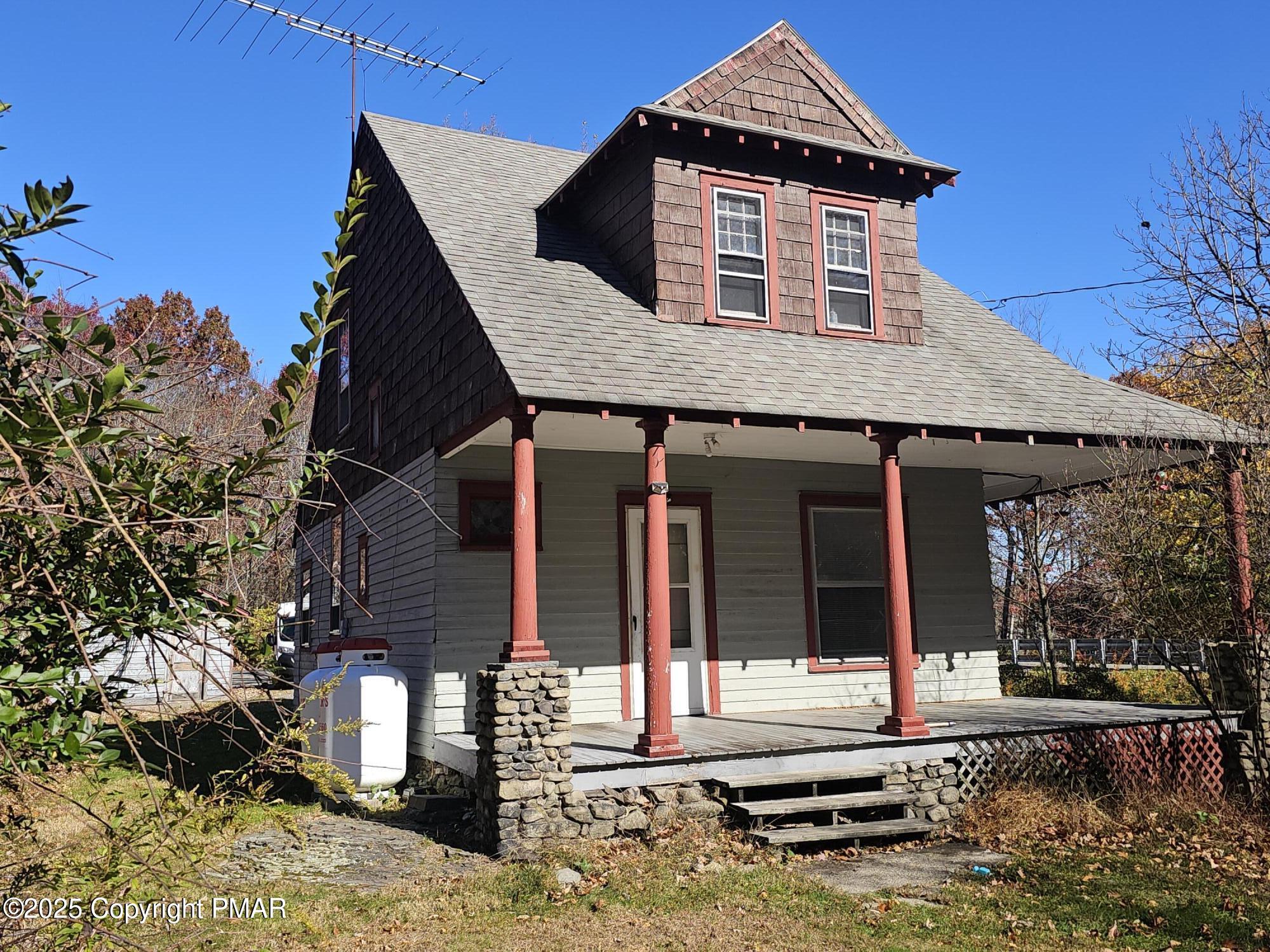 121 Hardytown Road Cresco, PA 18326 - Photo 1 of 35 a front view of a house with a yard