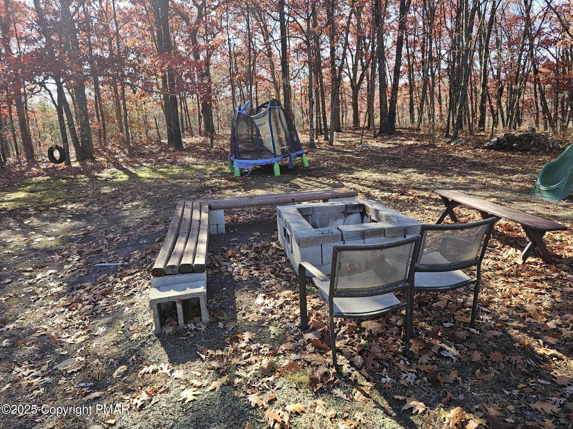 121 Hardytown Road Cresco, PA 18326 - Photo 24 of 35 a view of a backyard with table and chairs