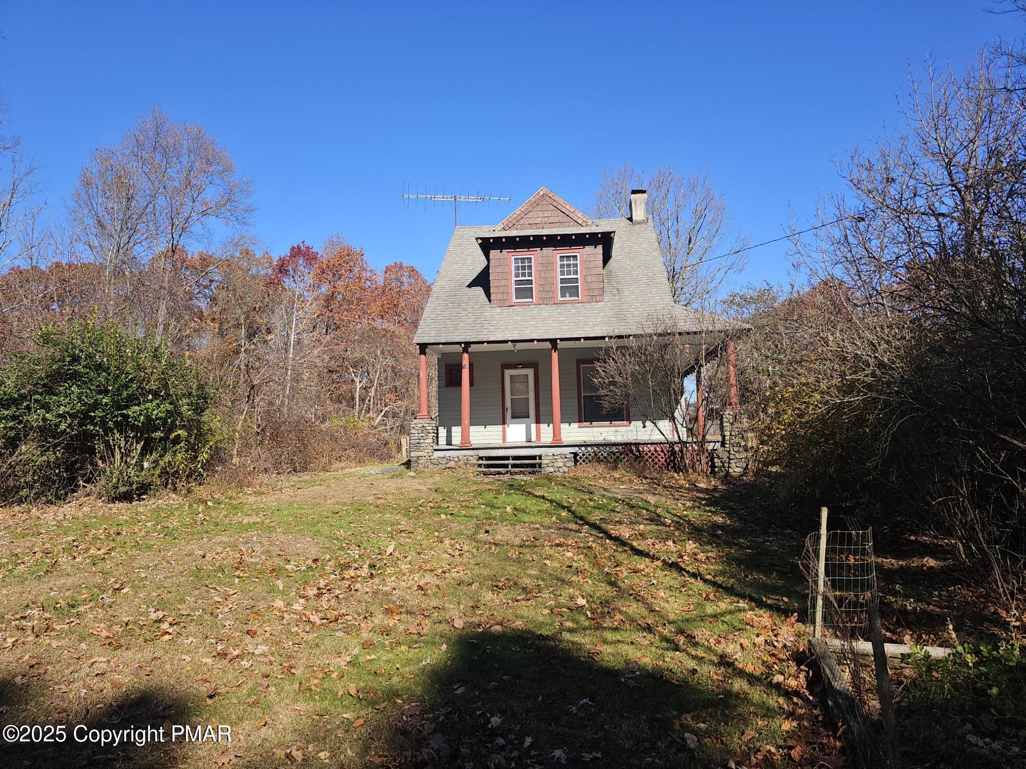 121 Hardytown Road Cresco, PA 18326 - Photo 3 of 35 a front view of a house with a yard
