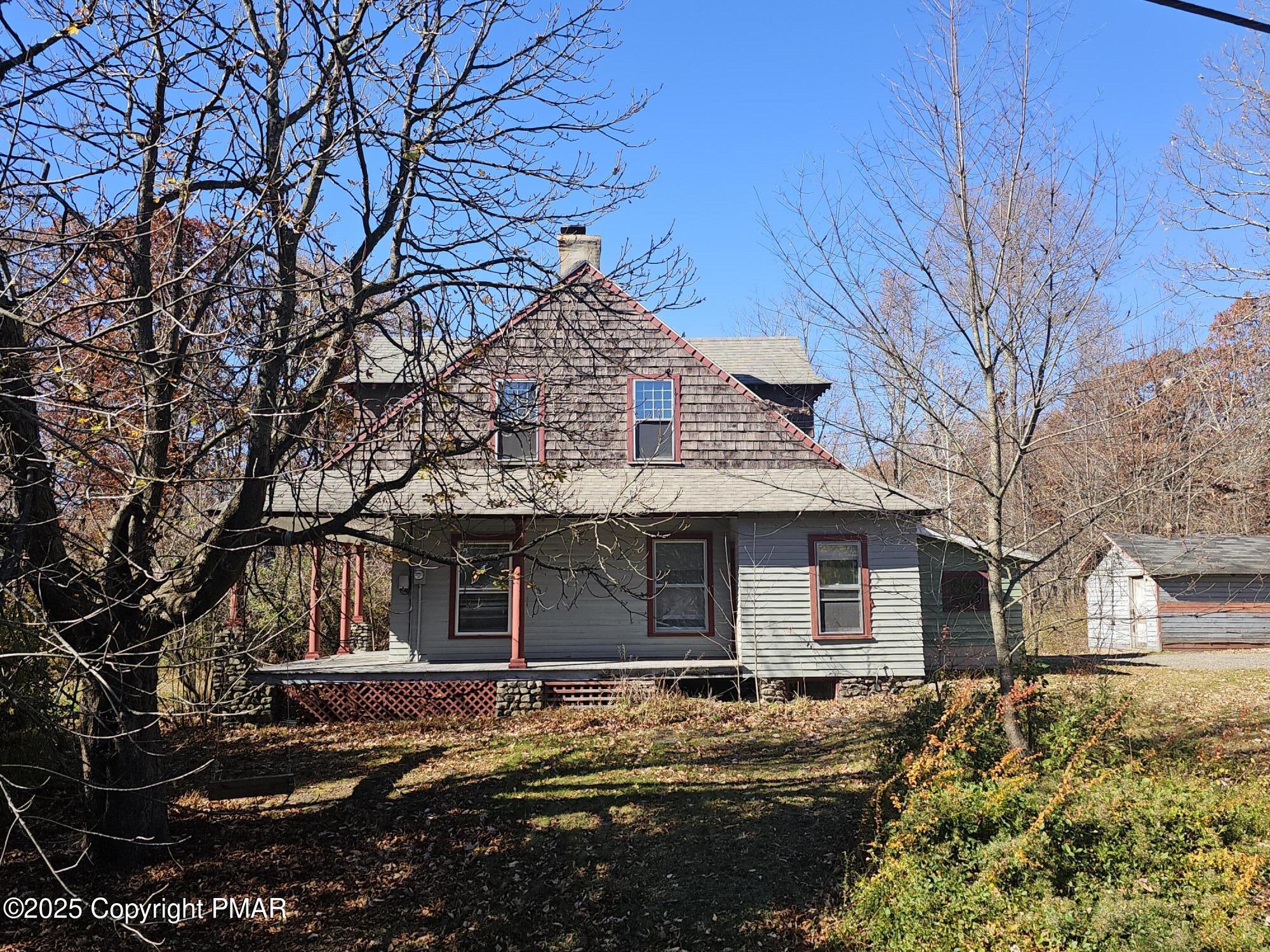121 Hardytown Road Cresco, PA 18326 - Photo 4 of 35 a front view of a house with a yard