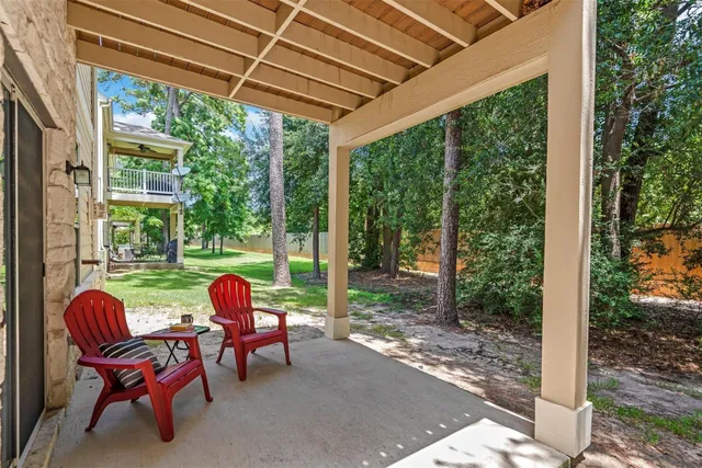 a view of a porch with furniture and next to window