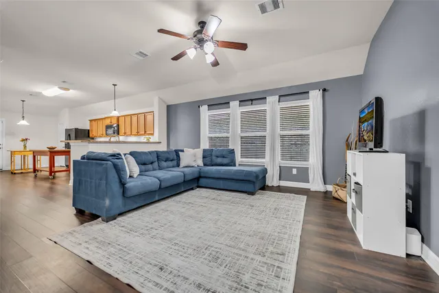 a living room with furniture and a large window