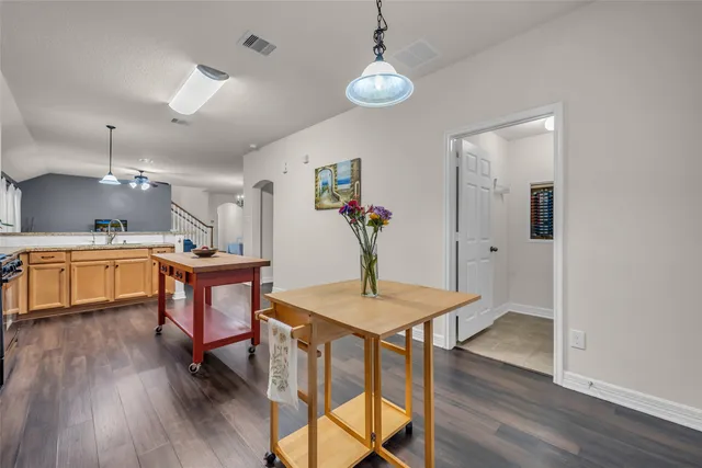 a view of a dining room with furniture and wooden floor