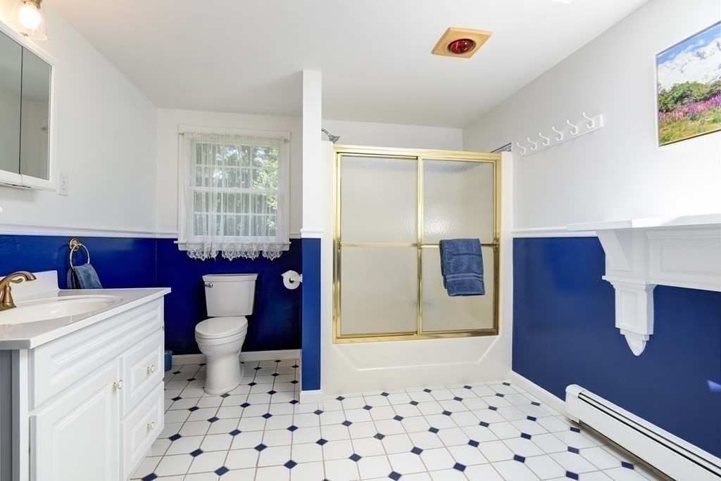 105 Sutton Road Needham, MA 02492 - Photo 23 of 38 a bathroom with a sink a toilet and shower
