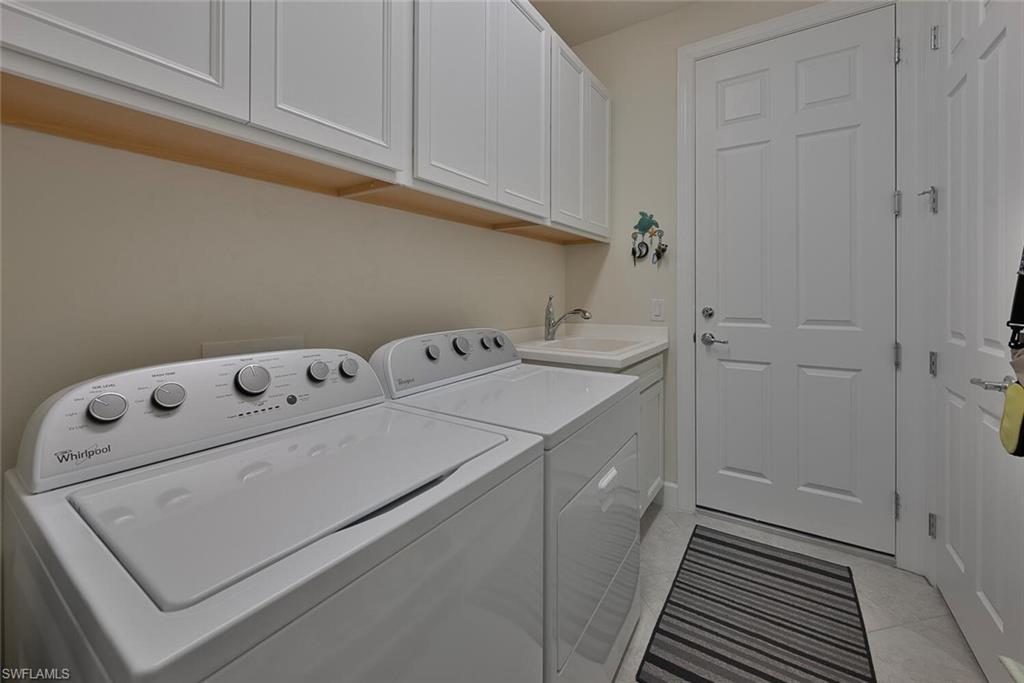 10709 Manatee Key Lane Estero, FL 33928 - Photo 13 of 18 a utility room with dryer and washer