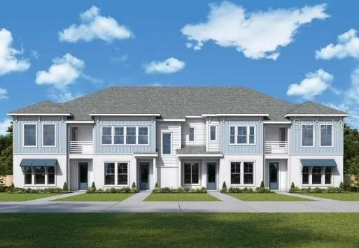 a front view of a residential apartment building with a yard