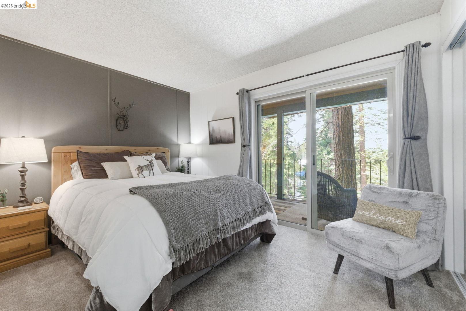 33840 Upper Leland Road, Unit 25A Pinecrest, CA 95364 - Photo 20 of 41 a bedroom with a bed and a couch