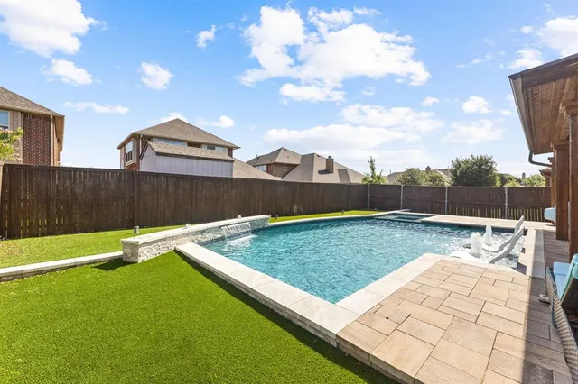a view of a house with swimming pool