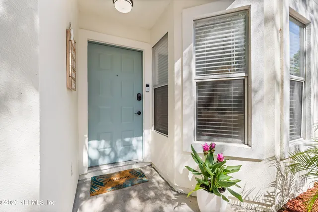 a bath room with a potted plant