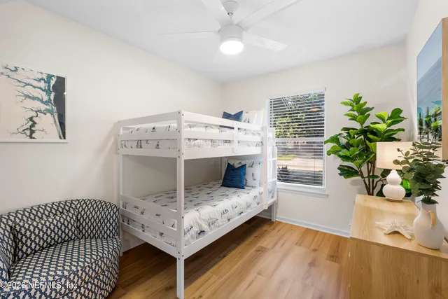 a living room with a couch and flowers