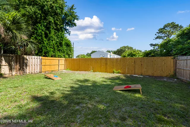 a backyard of a house with lots of green space