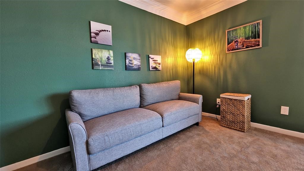 6726 Buffalo Speedway Houston, TX 77005 - Photo 24 of 30 a blue couch sitting next to a bathroom