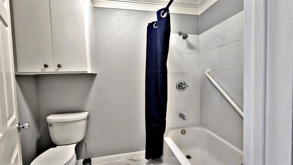 6726 Buffalo Speedway Houston, TX 77005 - Photo 26 of 30 a bathroom with a toilet and a sink