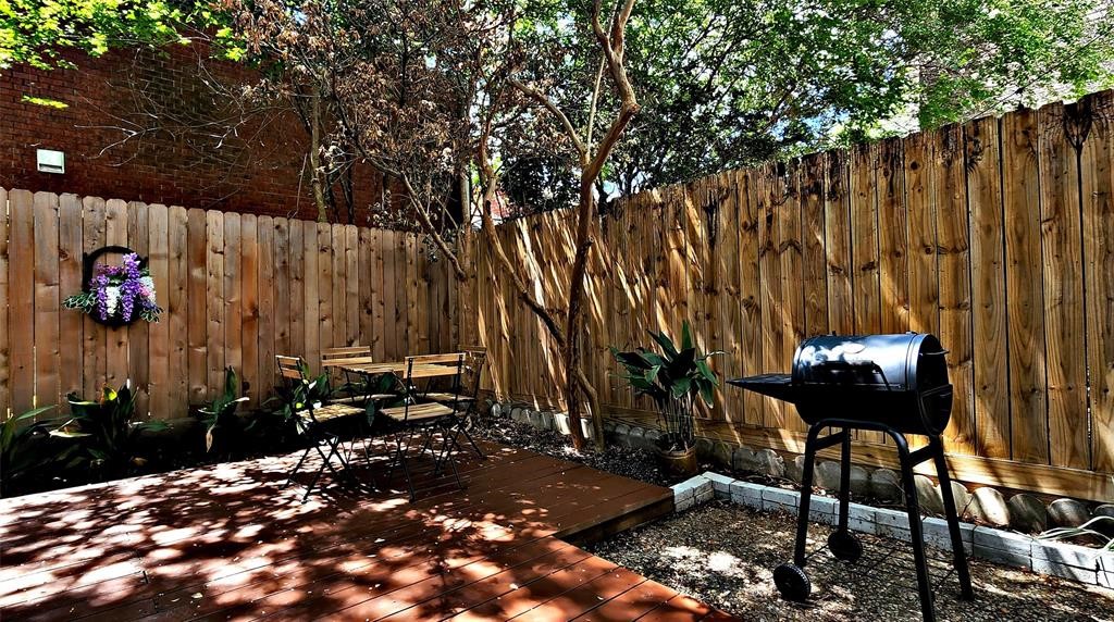 6726 Buffalo Speedway Houston, TX 77005 - Photo 29 of 30 a view of a chairs and table in backyard