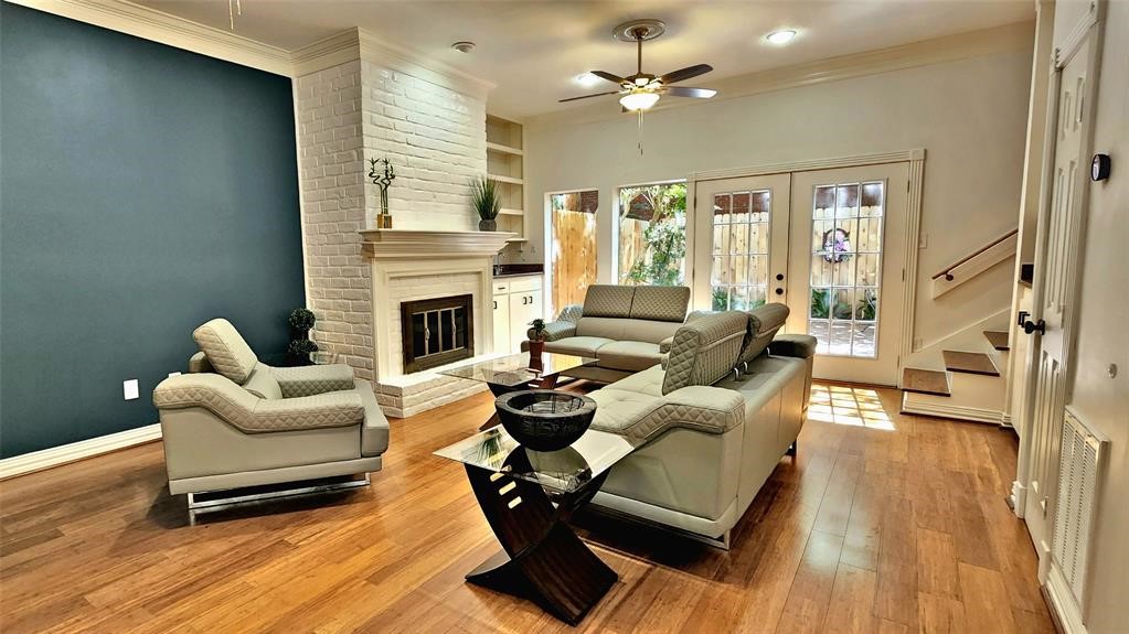 6726 Buffalo Speedway Houston, TX 77005 - Photo 4 of 30 a living room with furniture fireplace and wooden floor