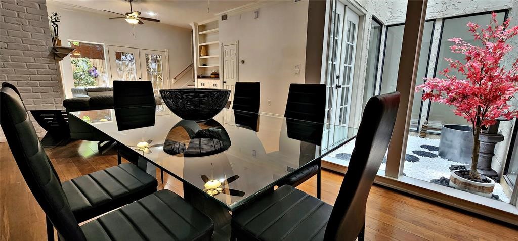 6726 Buffalo Speedway Houston, TX 77005 - Photo 5 of 30 a close view of dining table chairs and potted plants on a table