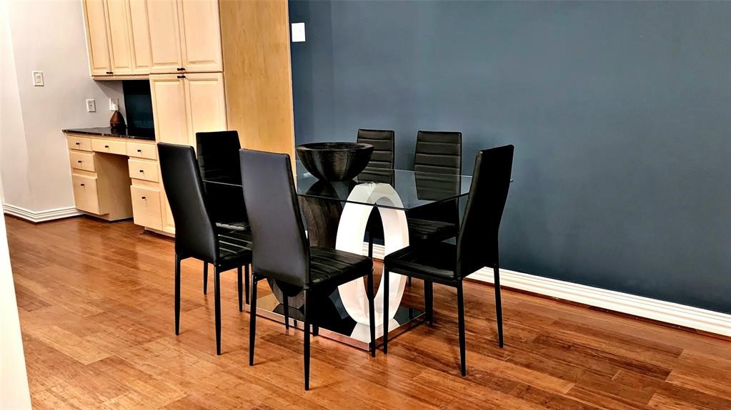6726 Buffalo Speedway Houston, TX 77005 - Photo 7 of 30 a view of a dining room with furniture and wooden floor
