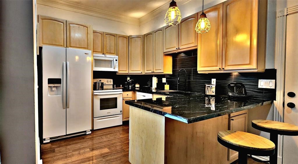 6726 Buffalo Speedway Houston, TX 77005 - Photo 8 of 30 a kitchen with stainless steel appliances a refrigerator a sink and a stove