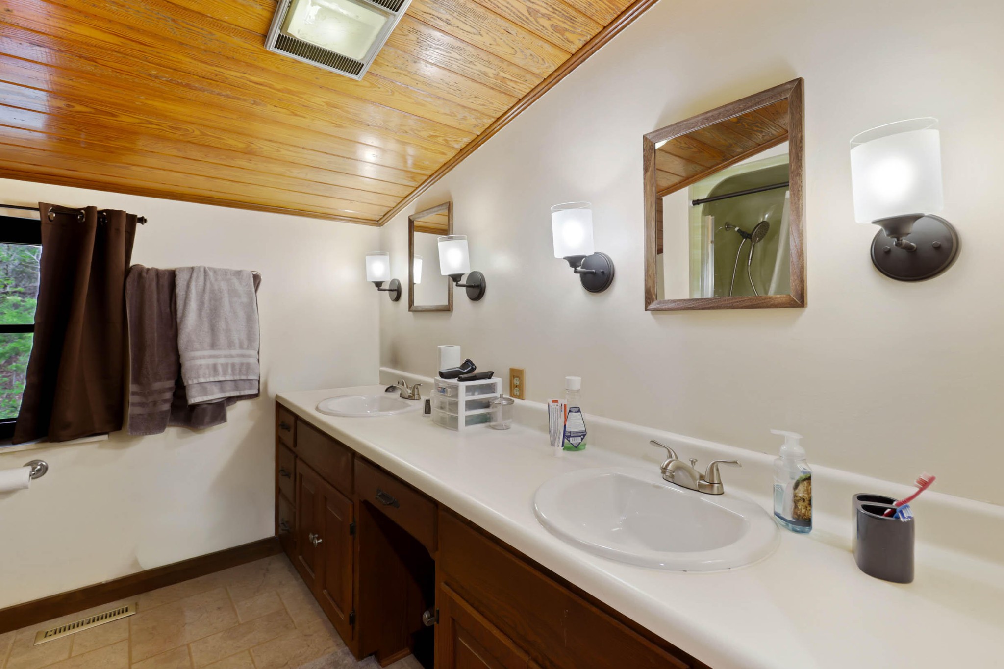 905 County Road 655 Athens, TN 37303 - Photo 29 of 47 a bathroom with a double vanity sink and a mirror