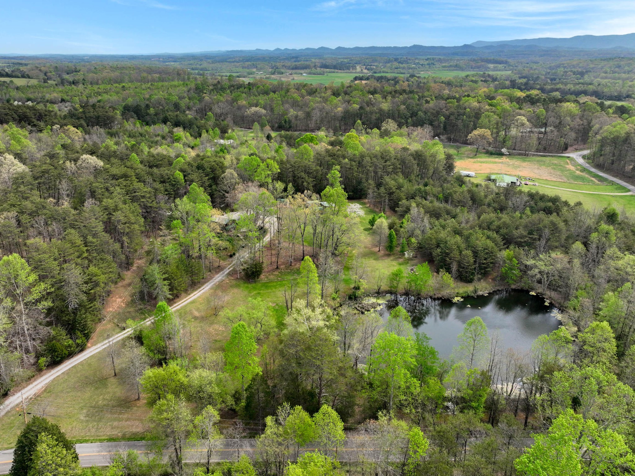 905 County Road 655 Athens, TN 37303 - Photo 40 of 47 a view of a lake with green field and mountains