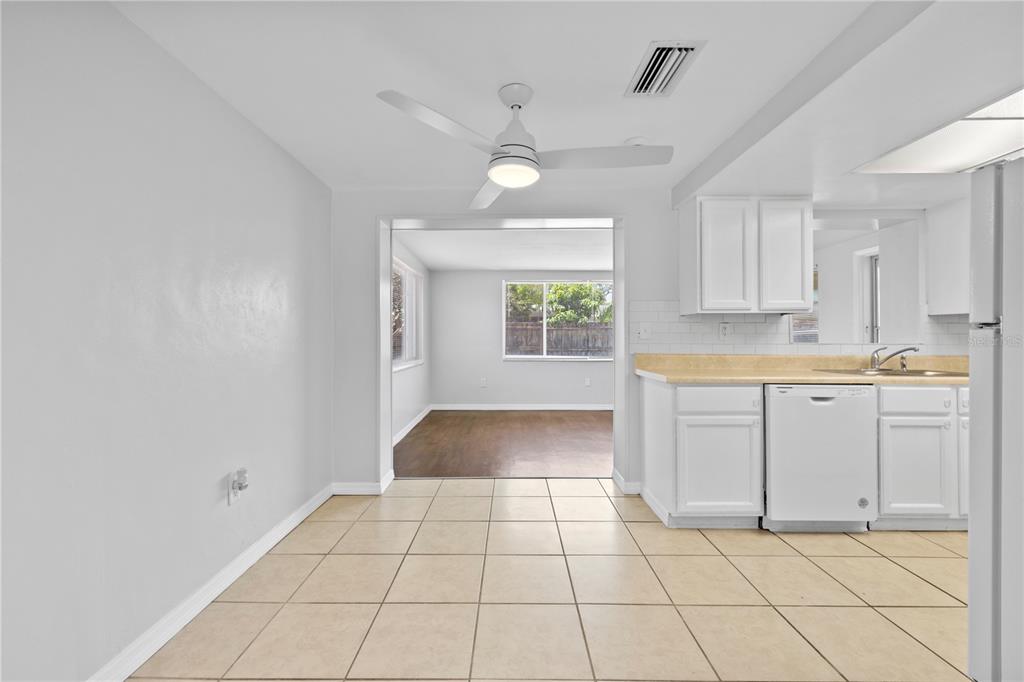 7330 Abalone Drive Port Richey, FL 34668 - Photo 19 of 49 a kitchen with a cabinets and window