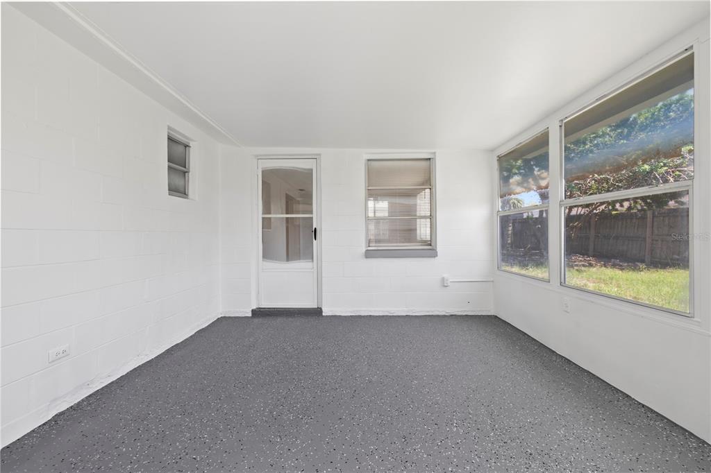 7330 Abalone Drive Port Richey, FL 34668 - Photo 23 of 49 an empty room with windows