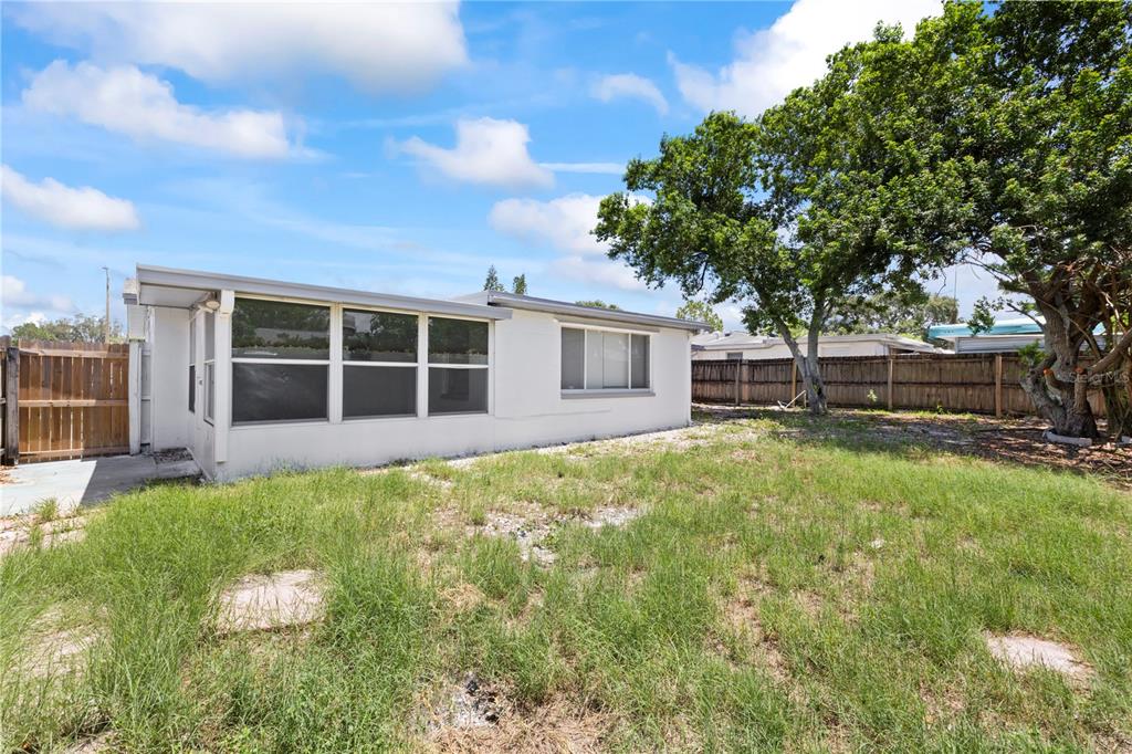 7330 Abalone Drive Port Richey, FL 34668 - Photo 40 of 49 a house view with a garden space
