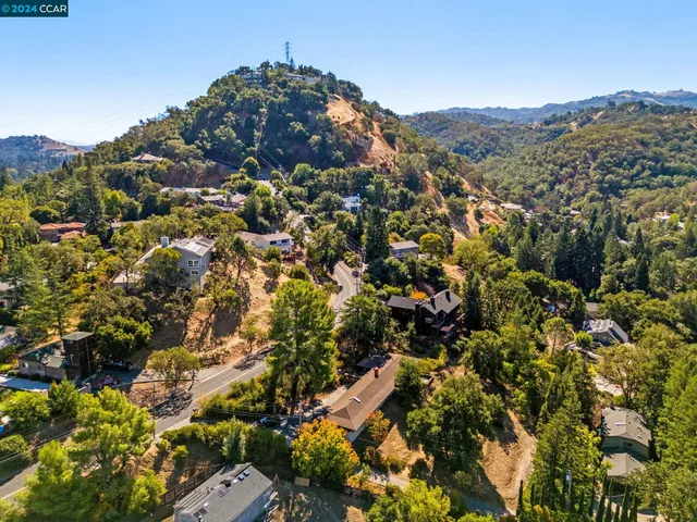 a bathroom with a sink a toilet and a large mirror