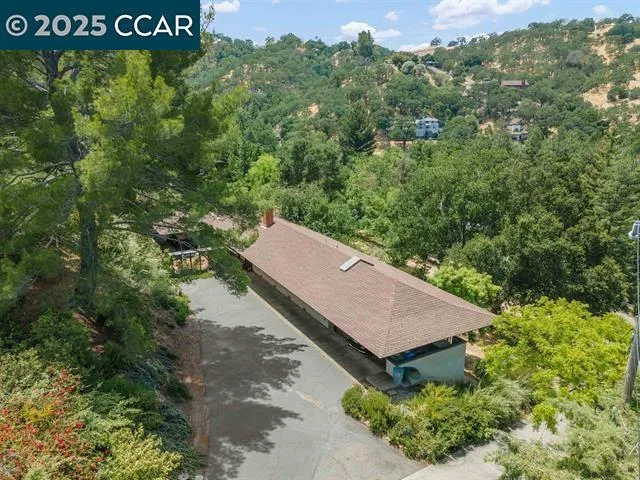 a house with swimming pool in front of it