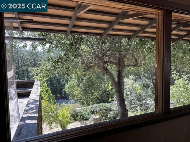 a view of room with window and furniture