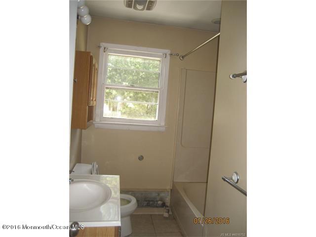 113 Launch Road Manahawkin, NJ 08050 - Photo 8 of 10 a bathroom with a toilet and a shower