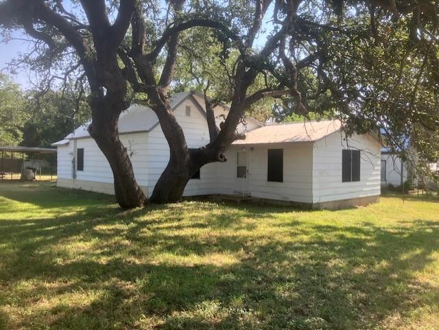 a view of a house with a yard