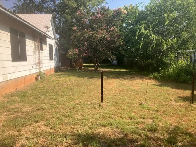 a backyard of a house with lots of green space