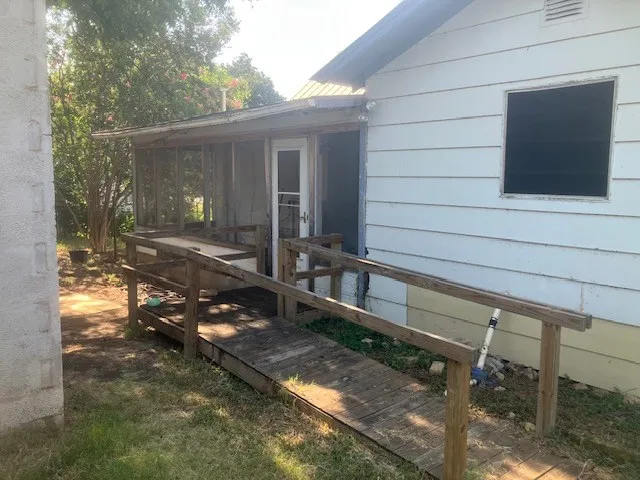 a kitchen with a sink a cabinets and window
