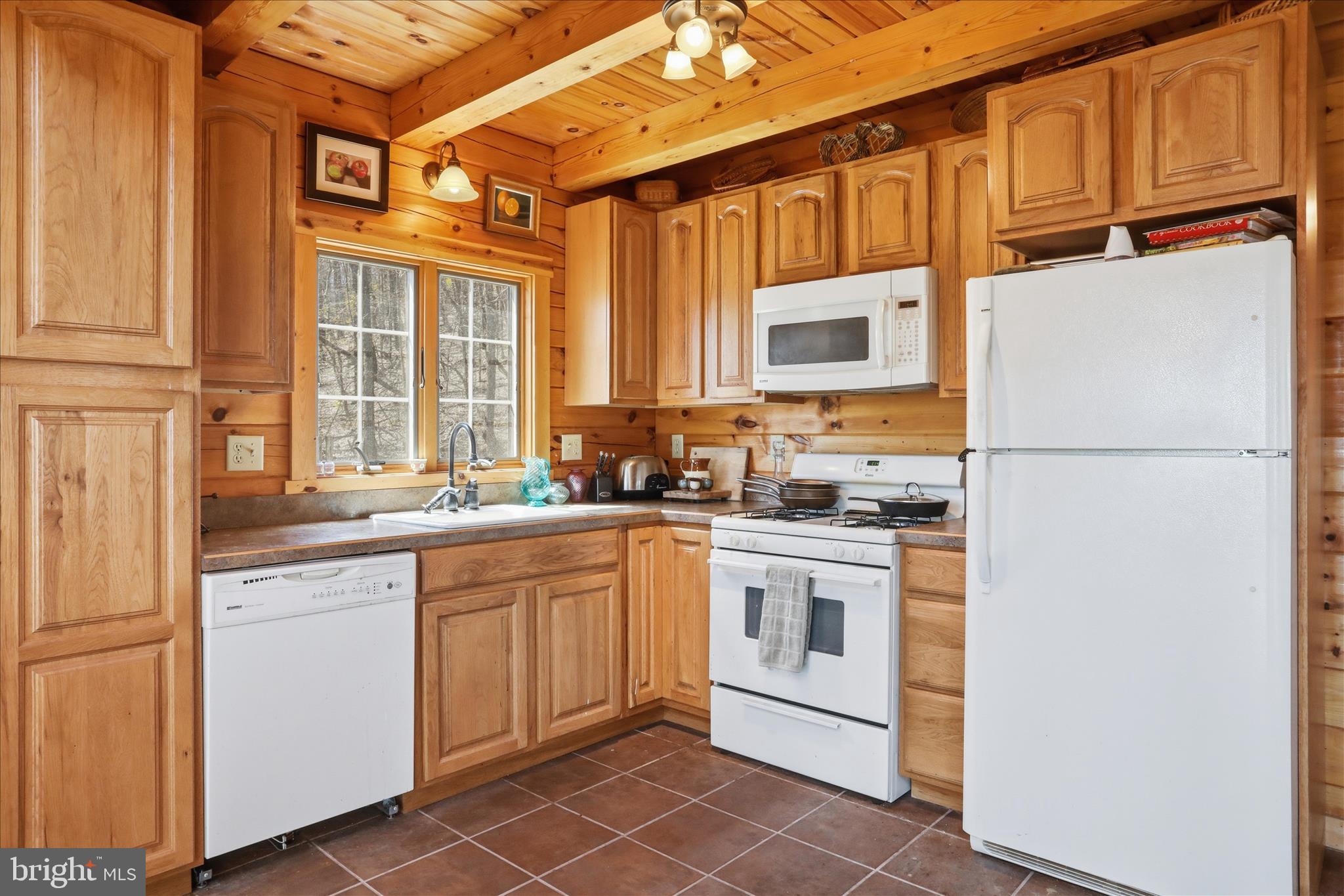 163 Olive Branch Road Rio, WV 26755 - Photo 15 of 70 a kitchen with stainless steel appliances granite countertop a refrigerator a stove a sink and a microwave