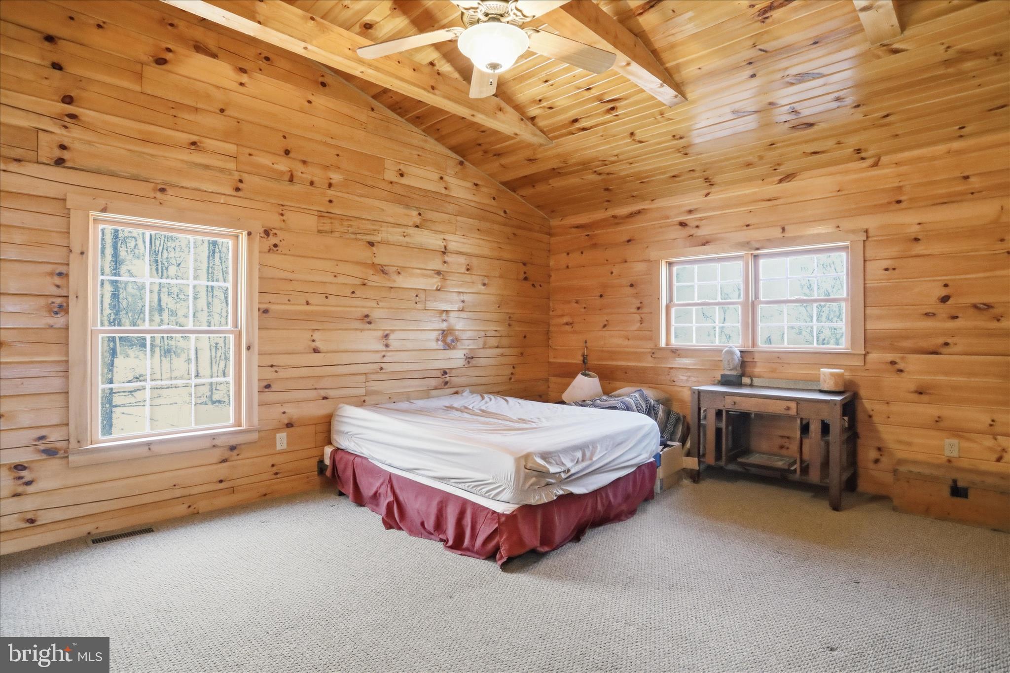 163 Olive Branch Road Rio, WV 26755 - Photo 24 of 70 a spacious bedroom with a bed and window