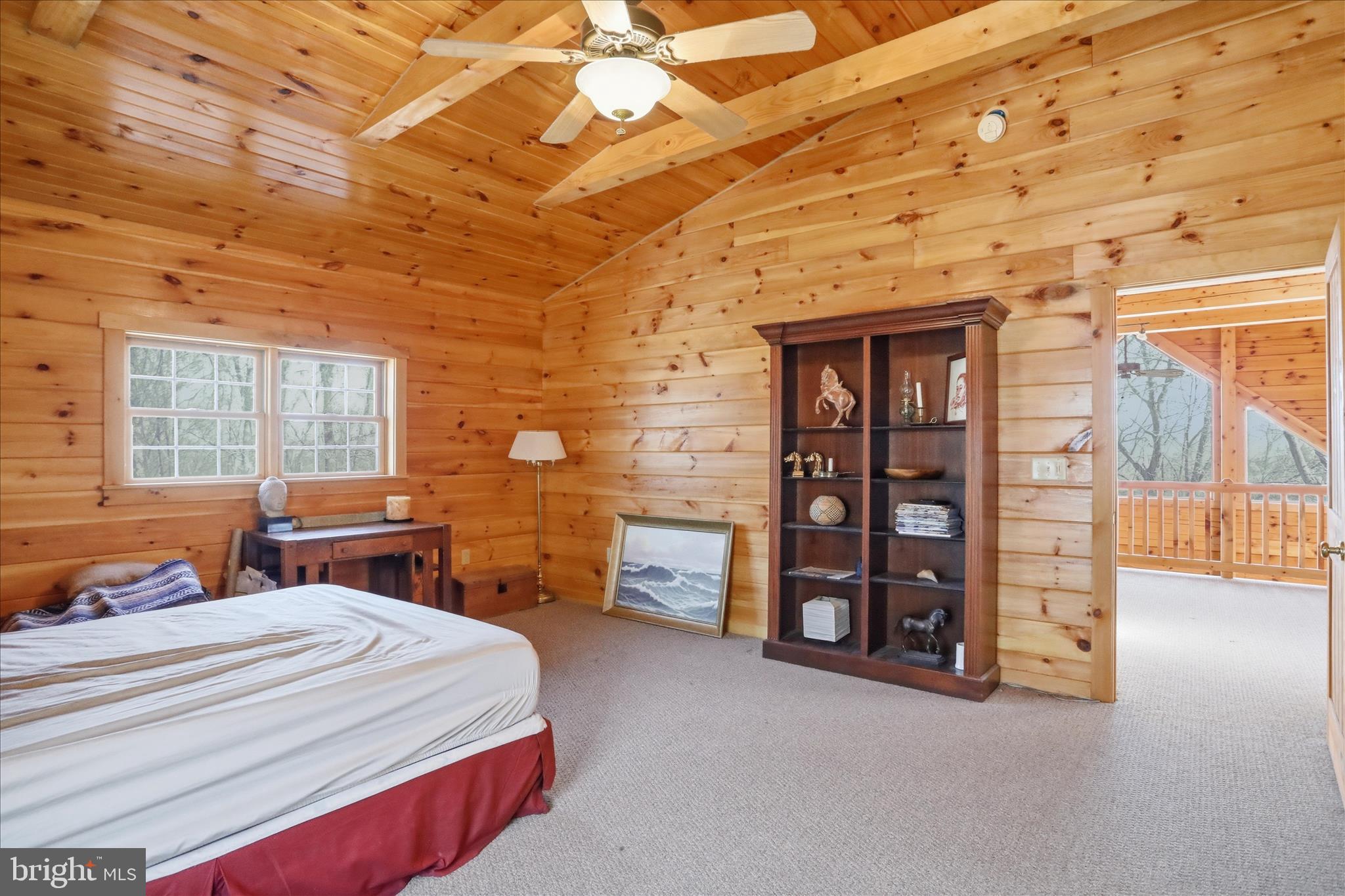 163 Olive Branch Road Rio, WV 26755 - Photo 26 of 70 a spacious bedroom with a bed and a table in it