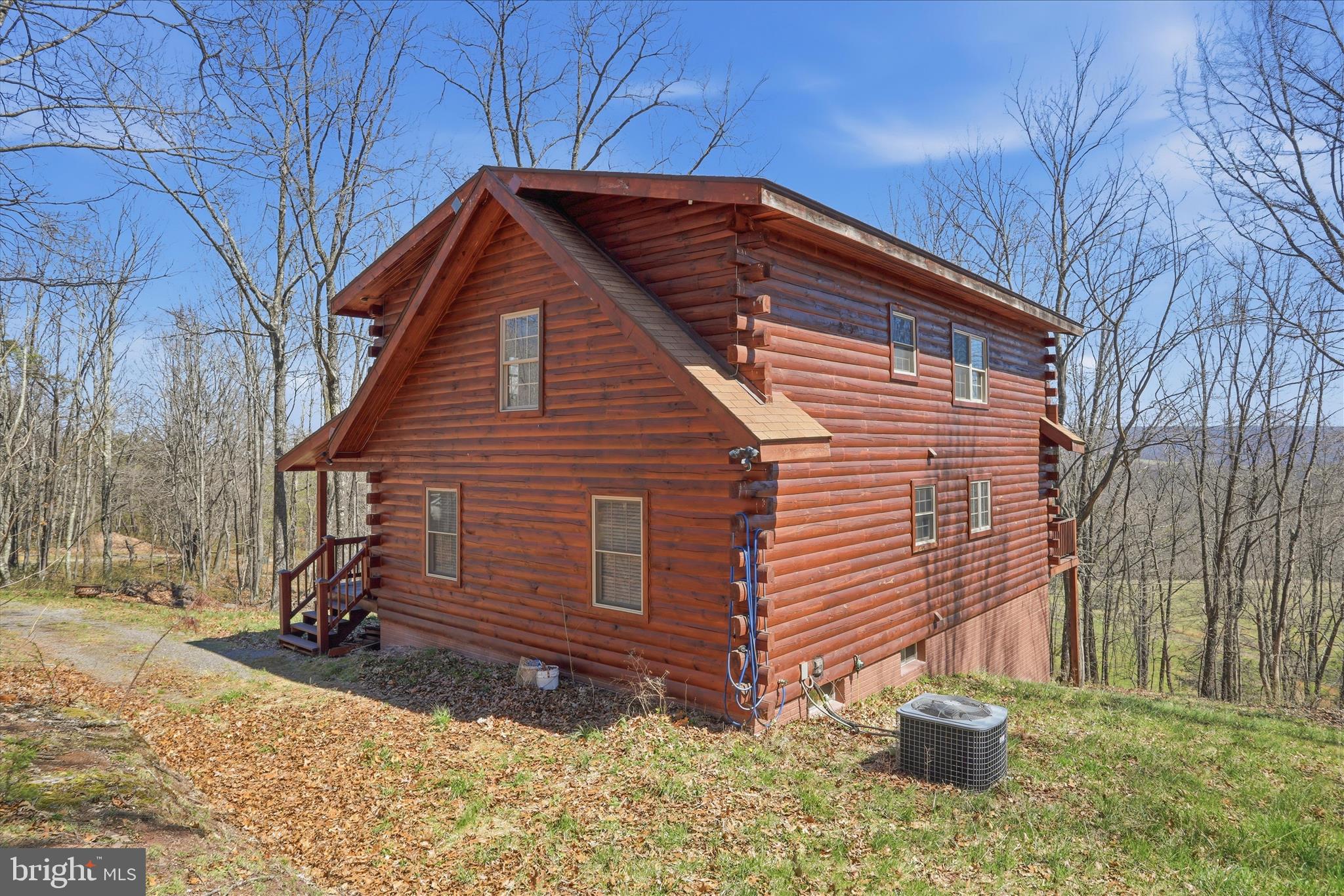 163 Olive Branch Road Rio, WV 26755 - Photo 36 of 70 a front view of a house with a yard