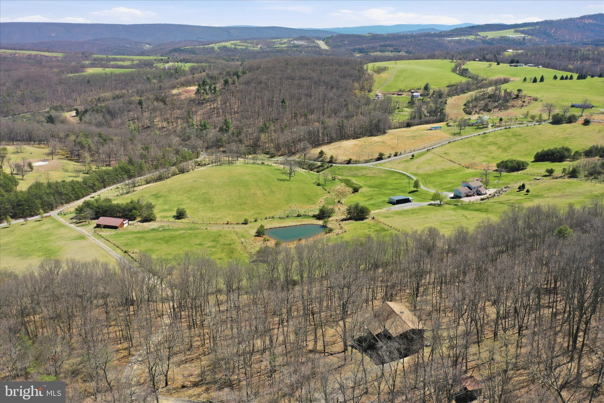 163 Olive Branch Road Rio, WV 26755 - Photo 69 of 70 a view of a lake with a mountain
