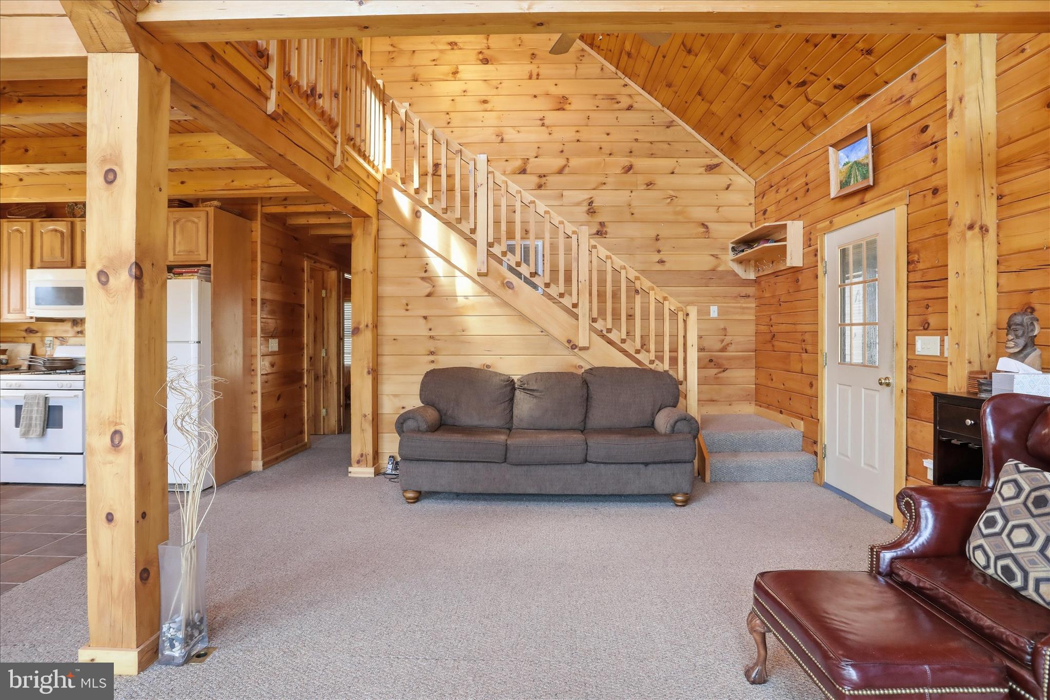 163 Olive Branch Road Rio, WV 26755 - Photo 8 of 70 a living room with furniture and a stair