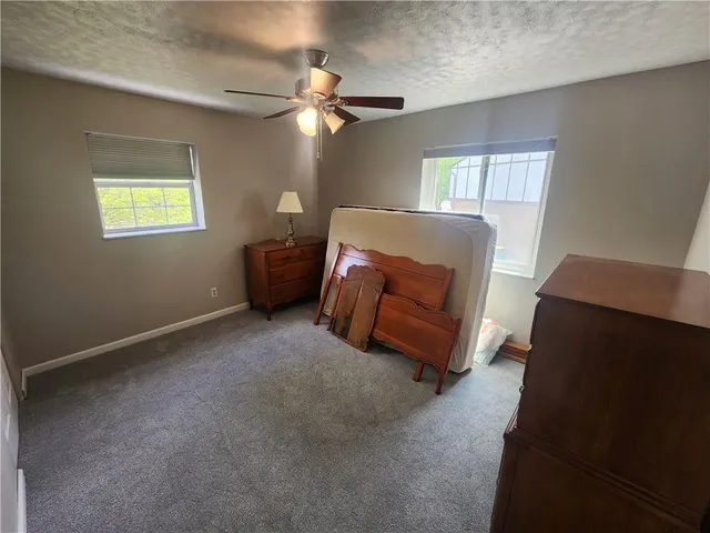 a view of livingroom with furniture and a window