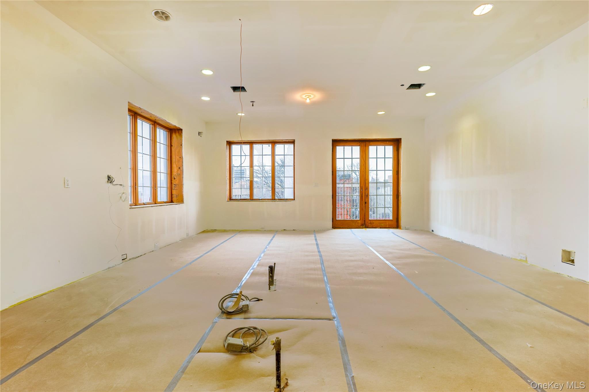 145 Classon Avenue, Unit 4A Brooklyn, NY 11205 - Photo 13 of 27 a view of an empty room with windows