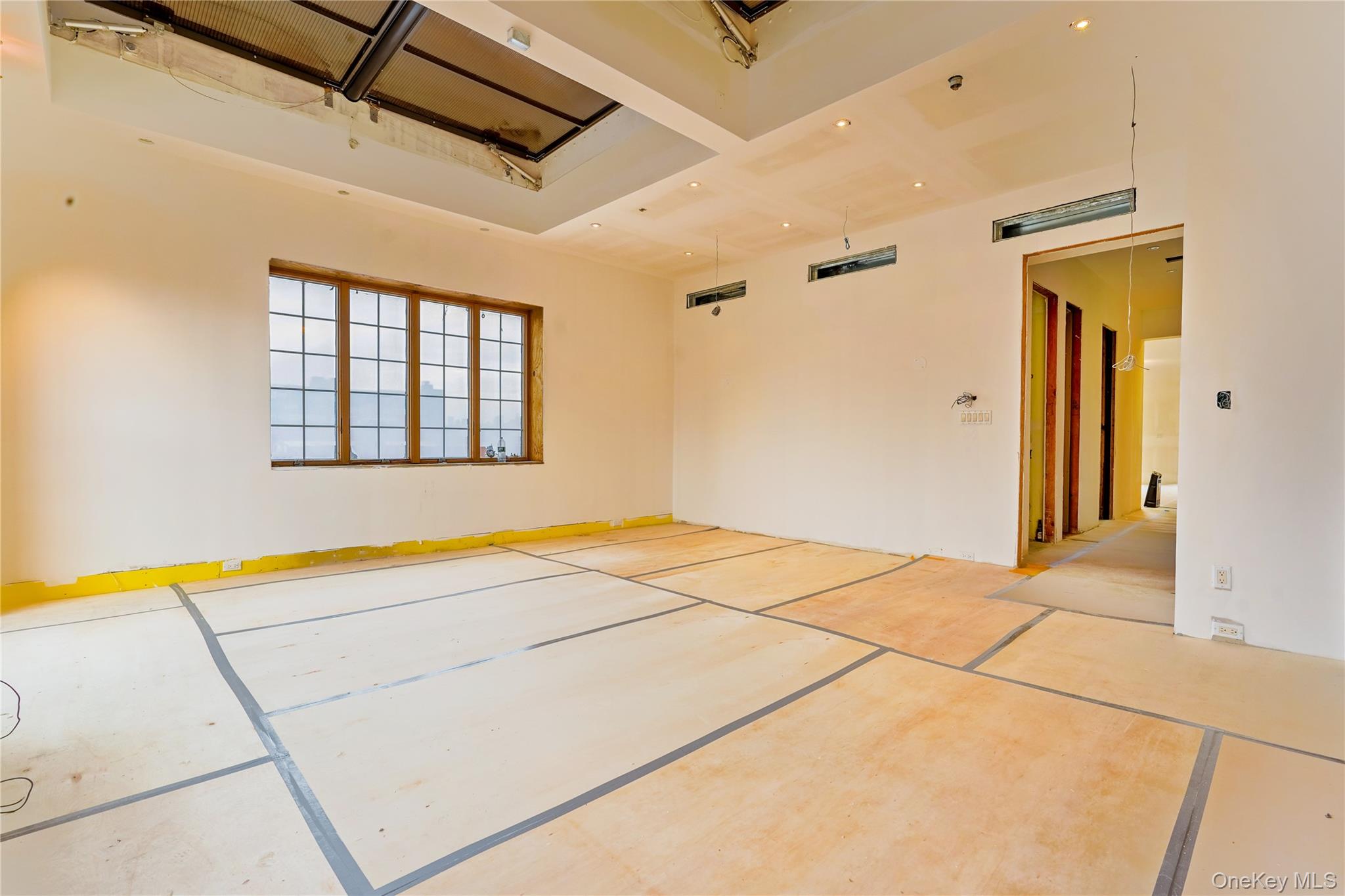 145 Classon Avenue, Unit 4A Brooklyn, NY 11205 - Photo 17 of 27 a view of an empty room with a window