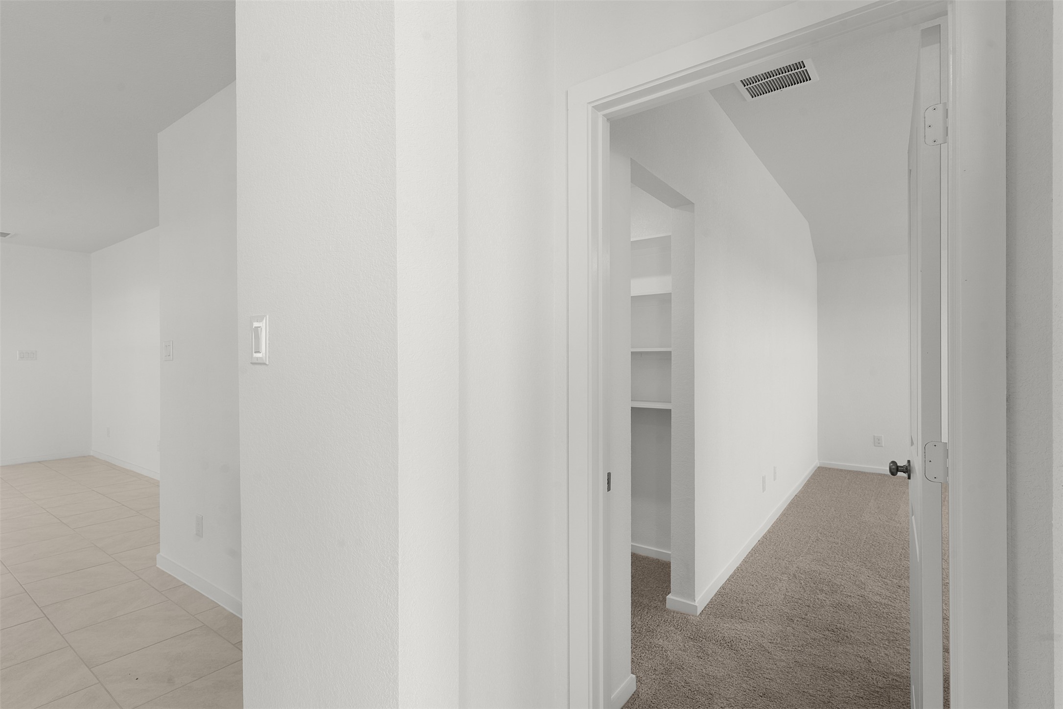 13832 Scarlett Song Drive Elgin, TX 78621 - Photo 11 of 26 Hallway with baseboards and light colored carpet