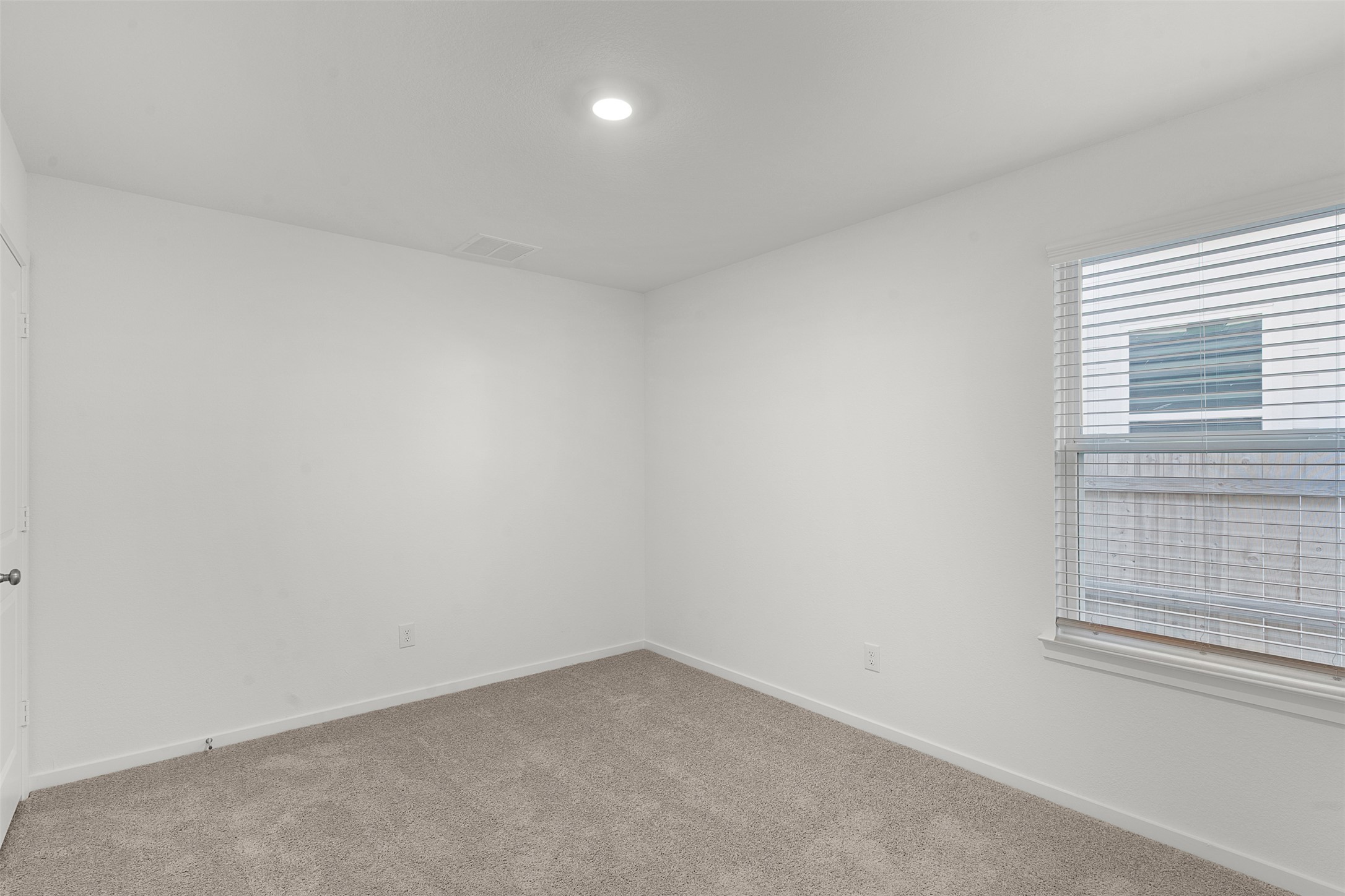 13832 Scarlett Song Drive Elgin, TX 78621 - Photo 17 of 26 Carpeted spare room with baseboards