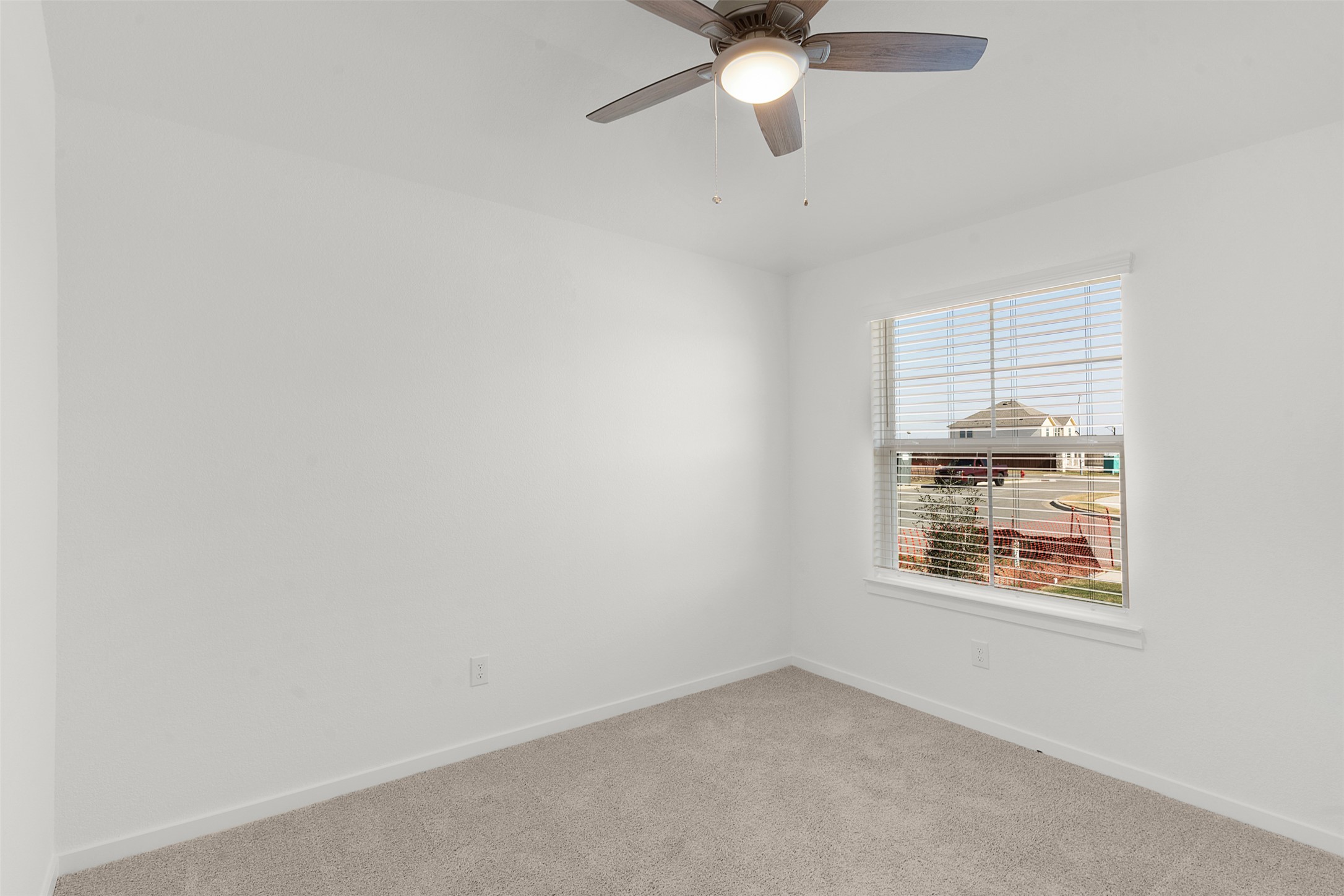 13832 Scarlett Song Drive Elgin, TX 78621 - Photo 3 of 26 Spare room with ceiling fan and carpet floors