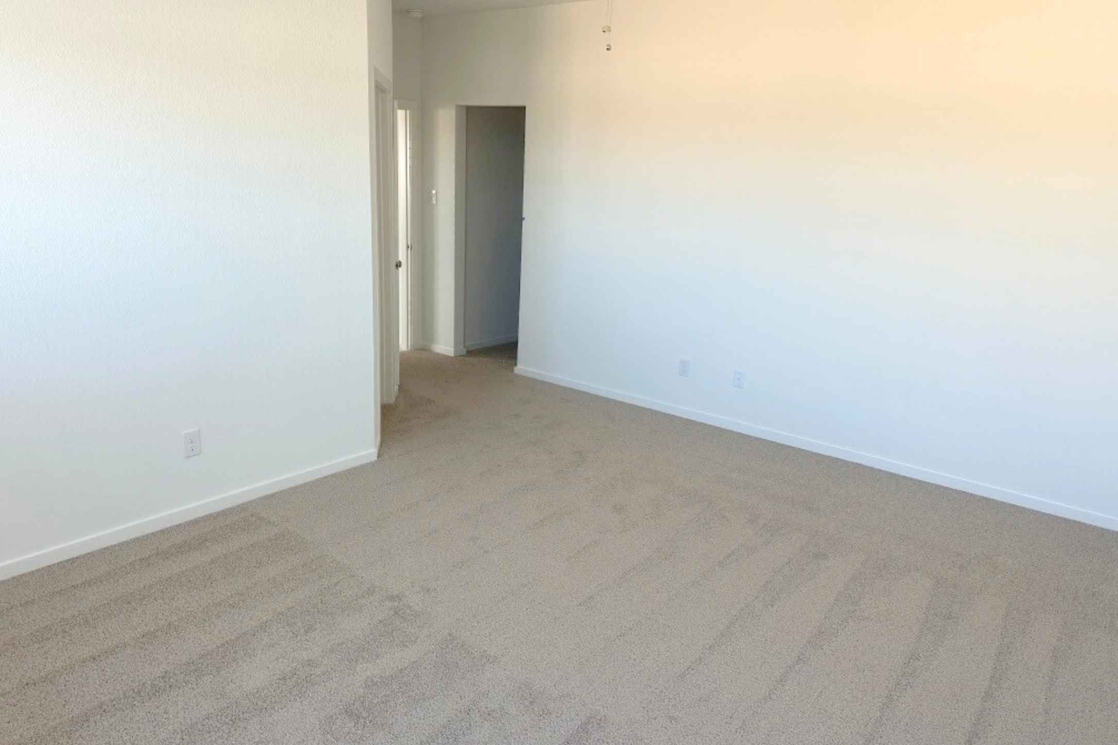 13832 Scarlett Song Drive Elgin, TX 78621 - Photo 7 of 19 Carpeted spare room with baseboards